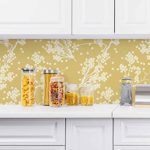 Treat yourself and your favorite room to this dreamy floral wallpaper that scatters whimsical white branches and flowers on a beige background with warm yellow undertones. The illustrations are basic and minimal, and arranged organically to create a seamless composition. Evoking warm autumnal vibes, this lovely peel and stick wallpaper complements its rich appearance with a non-toxic, PVC-free design.