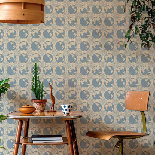 The perfect element of bedroom decor for a globetrotter, this fun peel and stick wallpaper sets a travel theme using a geometric arrangement of globes and compasses. Articulated in muted blue and beige tones, it has a relaxed, distinctly vintage vibe that makes a charming addition to contemporary spaces. The look of this PVC-free wallpaper is further enhanced by its rich matte finish.