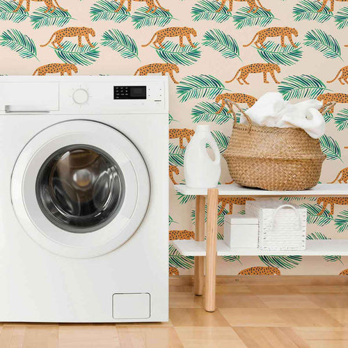Energize your living space with a gorgeous peel and stick wallpaper featuring leopards and leaves as small-scale illustrations on a pale pink background. This warm and vibrant wallpaper brightens up its surroundings with its intense orange notes and balancing green highlights. Complement this richly finished PVC-free wallpaper with indoor greenery, natural finishes and neutral toned fixtures for a delightful, earthy feel.