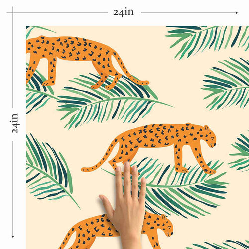 Energize your living space with a gorgeous peel and stick wallpaper featuring leopards and leaves as small-scale illustrations on a pale pink background. This warm and vibrant wallpaper brightens up its surroundings with its intense orange notes and balancing green highlights. Complement this richly finished PVC-free wallpaper with indoor greenery, natural finishes and neutral toned fixtures for a delightful, earthy feel.
