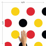 Sometimes, all you need to pep up your decor is a wall covered in happy polka dots. This peel and stick wallpaper places red, yellow and black polka dots on a white background. It is a seamless composition that can be used in spaces ranging from living rooms to children’s bedrooms. Its warm colors can be contrasted with blue and green elements to create a balanced vibe in any setting.