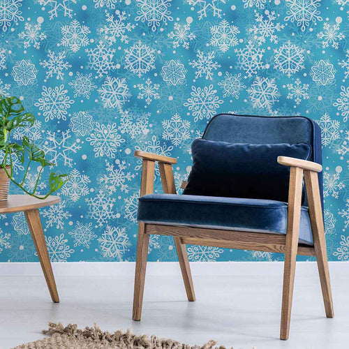 Let your decor hark of snow covered landscapes and relaxing holiday vibes with this beautiful blue peel and stick wallpaper. Featuring snowflake motifs on a sky blue background, it makes use of gentle color variations to produce a rich, layered effect that is perfectly complemented by a matte finish.