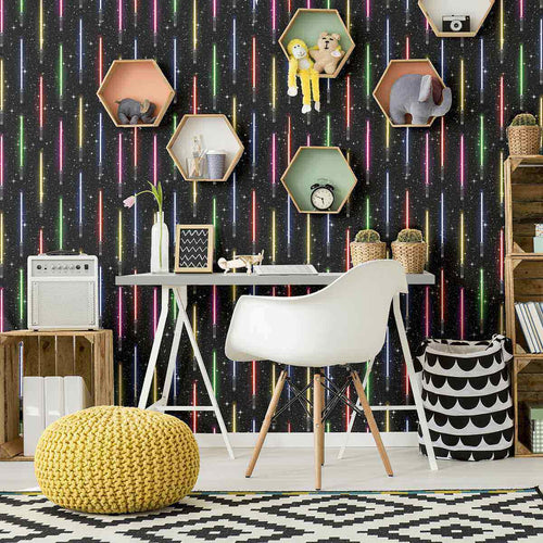 A stunning wall covering from a galaxy far far away! This Star Wars themed peel and stick wallpaper presents vertically arranged light sabers on a starry black background. Exuberant and emphatic, this design is made to make heads turn. At the same time, it has the structured feel of a striped composition, and as such can easily lend itself to formal spaces that enjoy a bit of whimsy.