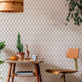 An elegant trellis takes on a fun, new-age vibe in this unique geometric wallpaper. The teardrop shaped motifs in this grey and white peel and stick wallpaper are arranged in neat rows facing alternate directions to create a charming lattice that brings an informal yet structured feel to your living space. This versatile design will bring time-tested elegance to your upbeat modern bedroom or home office.