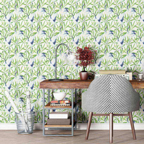 Elegant Japanese cranes flock amid lush green leaves in this vibrant peel and stick wallpaper