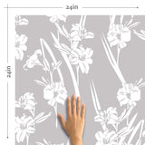 Scattering artistic all-white flowers all over a gray background removable wallpaper
