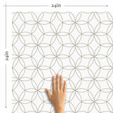 A simple design that celebrates the magic of geometry, this peel and stick wallpaper features a seamless, structured arrangement of intersecting circles. The circles are outlined in black on a white background. Their scale and minimal line weights give this wallpaper a polished sophistication that can easily blend with classic or Art Deco settings, while at the same time remaining perfectly compatible with informal contemporary spaces.