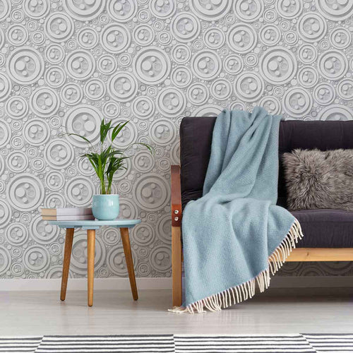 Finding intricacy in the simplest of shapes, this lovely geometric peel and stick wallpaper uses circles of different sizes to create a rich, almost oceanic feel. Rendered mostly in white, this distinctive design makes use of shadows printed in grey to create a raised, 3D effect that further enhances its tactile richness.&nbsp;This PVC-free wallpaper is the perfect add-on to a white-toned setting where the only thing missing is some visual texture.&nbsp;