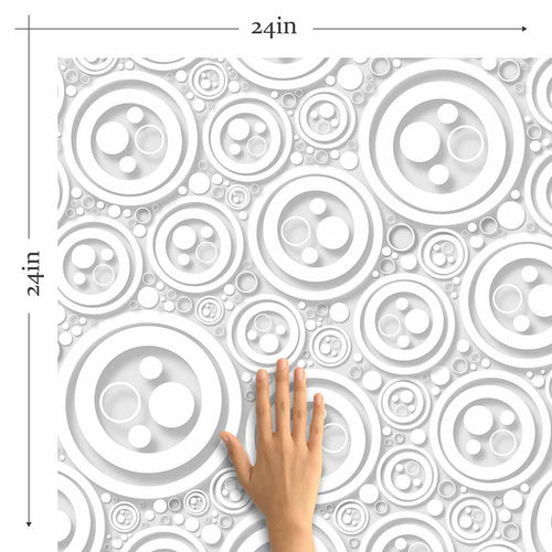 Finding intricacy in the simplest of shapes, this lovely geometric peel and stick wallpaper uses circles of different sizes to create a rich, almost oceanic feel. Rendered mostly in white, this distinctive design makes use of shadows printed in grey to create a raised, 3D effect that further enhances its tactile richness.&nbsp;This PVC-free wallpaper is the perfect add-on to a white-toned setting where the only thing missing is some visual texture.&nbsp;