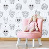 Beware, these doggos are as cool as they are cute! Bring home this fun dog themed wallpaper that features expressive and adorable canine faces, some of them wearing shades. They appear as simple but attractive line drawings, arranged in staggered rows with polka dots between them. This PVC-free peel and stick wallpaper strikes a charming balance between versatile and whimsical.