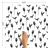 This carefree floral wallpaper will win you over with its simple and irresistible charm! Featuring black floral illustrations on a white background, it keeps things straightforward and versatile. The magic happens within the illustrations themselves. Flowers and leaves are represented as winged elements taking flight and giving the entire seamless composition a whimsical, cheerful appearance.