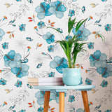 Take your decor on a blissful sojourn with this floral blue wallpaper that is just the right blend of relaxed and dynamic. Hibiscus blossoms are pictured all over the wall covering in gentle blue tones with a watercolor style, while little orange highlights energize the seamless and organic composition.&nbsp;Bring home a ton-toxic, PVC-free wall treatment that is both functionally and aesthetically a safe choice!