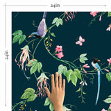 Blossoms, bugs, butterflies and birds, each more exotic than the next – this exquisite peel and stick wallpaper is a slice of paradise! This dramatic design sets the mood with a deep blue-green background, against which the tropical flora and fauna appear in delightfully contrasting greens, pinks, blues and purples.&nbsp;This PVC-free wallpaper will enrich settings ranging from vintage to modern in a heartbeat.