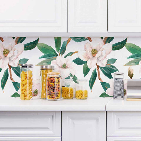 For your next home makeover, treat your walls to this luxuriously vintage floral wallpaper featuring pale pink blossoms and deep green leaves on a white background. The large scale of the botanical elements gives the composition a flamboyant feel that makes it perfect as an eye-catching highlight such as a feature wall or a distinctive kitchen backsplash.