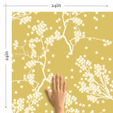 Treat yourself and your favorite room to this dreamy floral wallpaper that scatters whimsical white branches and flowers on a beige background with warm yellow undertones. The illustrations are basic and minimal, and arranged organically to create a seamless composition.&nbsp;Evoking warm autumnal vibes, this lovely peel and stick wallpaper complements its rich appearance with a non-toxic, PVC-free design.
