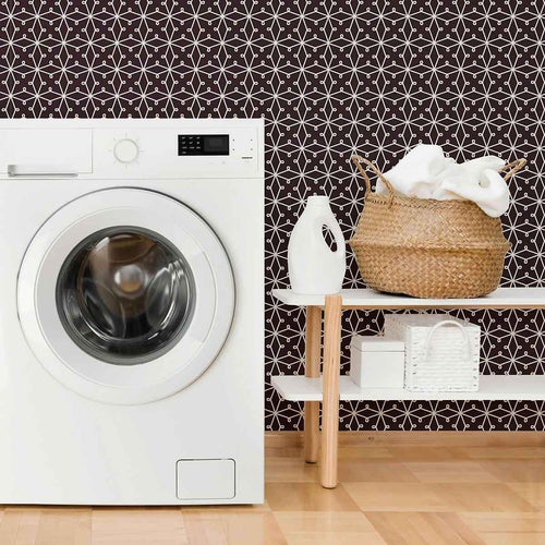 Abstracting a&nbsp;lacy pattern&nbsp;into a network of straight lines, this geometric peel and stick wallpaper finds the sweet spot between organic and structured. Its deep purple background gives it a rooted, regal vibe, on which the white illustrations appear as a stylish contrast. This PVC-free wall covering has a versatile, scalable look that can stylize both expansive rooms and compact surfaces.