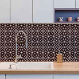 Abstracting a&nbsp;lacy pattern&nbsp;into a network of straight lines, this geometric peel and stick wallpaper finds the sweet spot between organic and structured. Its deep purple background gives it a rooted, regal vibe, on which the white illustrations appear as a stylish contrast. This PVC-free wall covering has a versatile, scalable look that can stylize both expansive rooms and compact surfaces.