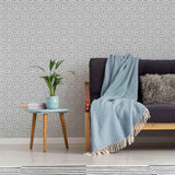 Embrace refined elegance with this geometric grey peel and stick wallpaper that also exudes a lovely botanical vibe. Curvilinear motifs with a floral inspiration come together to create a beautiful white lattice on a grey background, and result in a wall treatment that will align with any kind of setting. This PVC-free, eco-friendly wallpaper is a safe bet both aesthetically and in terms of maintaining a healthy indoor environment.