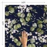Vintage botanical vibes take a fun detour in this unique floral wallpaper that is guaranteed to rev up your home’s style quotient. White flowers and green leaves appear in a sketchy, playful style on a deep blue background, creating a dramatic yet delicate composition that is just the upgrade that a dull space needs.
