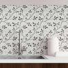 A basic botanical design with a lovely layered look, this peel and stick wallpaper is a useful and reliable decor choice. It features slender branches with petite leaves climbing diagonally across the panels. The leaves are articulated in dark grey tones on a light grey background, while cleverly printed shadows add a raised effect. Serene and sophisticated, this PVC-free wallpaper is all you need for an instant style boost.