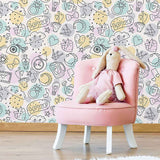 Packed in clouds, wrapped in presents, tied up in bows, served in hot cuppas, held up as signs – love can be found in just about everything in this lovely and relaxed peel and stick wallpaper. A joyful, colorful yet subtle element of decor for your child’s room, it can also be appreciated by grown-ups with a whimsical sense of style!