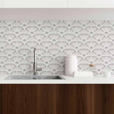 Enrich your living space with texture and geometry with the help of this unique peel and stick wallpaper that carries a 3 dimensional look. Square meshes appear to overlap and change directions to give this design an abstract, mechanical vibe. Use this grey and white PVC-free wallpaper to bring a futuristic ambiance to a contemporary living space.