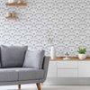 Enrich your living space with texture and geometry with the help of this unique peel and stick wallpaper that carries a 3 dimensional look. Square meshes appear to overlap and change directions to give this design an abstract, mechanical vibe. Use this grey and white PVC-free wallpaper to bring a futuristic ambiance to a contemporary living space.