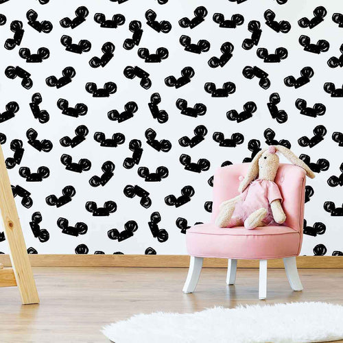 Set a Disney theme in one quick move with this delightful black and white wallpaper! Featuring black Mickey Mouse ears on a white background, it firmly establishes that less is more. The animated, seamless composition is a versatile wall treatment that works in all kinds of spaces. Besides your child’s room, you can get adventurous with it even in your living room or home office.