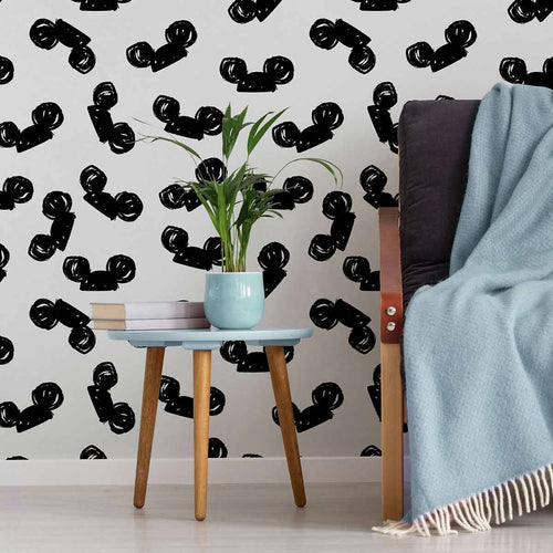 Set a Disney theme in one quick move with this delightful black and white wallpaper! Featuring black Mickey Mouse ears on a white background, it firmly establishes that less is more. The animated, seamless composition is a versatile wall treatment that works in all kinds of spaces. Besides your child’s room, you can get adventurous with it even in your living room or home office.