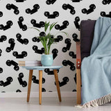 Set a Disney theme in one quick move with this delightful black and white wallpaper! Featuring black Mickey Mouse ears on a white background, it firmly establishes that less is more. The animated, seamless composition is a versatile wall treatment that works in all kinds of spaces. Besides your child’s room, you can get adventurous with it even in your living room or home office.