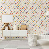 Fun, multicolor polka dots articulated in hurried strokes on an off-white background – this peel and stick wallpaper sports a simple, well-loved design you can’t go wrong with. This PVC-free wall covering could easily become your kids’ room staple, and can also be experimented with in other bedrooms and family spaces.