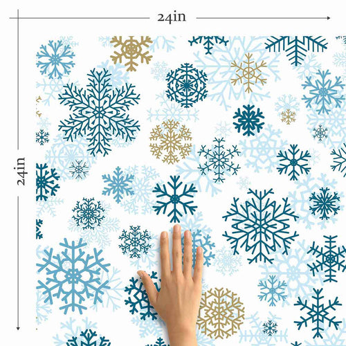 Give winter a warm welcome with this snowflake themed peel and stick wallpaper. Featuring a plethora of gorgeous snowflakes in multiple sizes and shades of blue and beige, this attractive design has a richly layered look. The intricate motifs and their cleverly printed shadows give the entire design a 3D feel. The combination of blue and white works particularly well when contrasted with warm woodsy treatments and natural finishes.