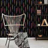 A stunning wall covering from a galaxy far far away! This Star Wars themed peel and stick wallpaper presents vertically arranged light sabers on a starry black background. Exuberant and emphatic, this design is made to make heads turn. At the same time, it has the structured feel of a striped composition, and as such can easily lend itself to formal spaces that enjoy a bit of whimsy.
