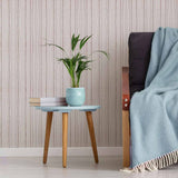 The softer side of stripes, brought to you in the form of a warming, welcoming peel and stick wallpaper! This charming design fits right into chic urban spaces, enriching them with a rough-hewn look and warm beige tones. The vertical stripes in this seamless composition have a hurried, hand drawn feel to them, which is enhanced further by a dry brush effect. A rich matte finish completes the look.