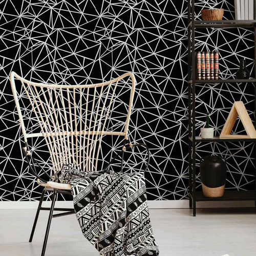 Need a wall treatment that knows how to have fun while also staying stylish? This seamless pattern of triangles that don’t follow the rules will do the trick! This black geometric wallpaper features a dynamic mosaic of triangles outlined in white. The busy pattern retains a basic structure that allows it to stabilize spaces while also helping them stand out.&nbsp;Use this PVC-free wallpaper to create a bold feature wall the next time you upgrade your living room.