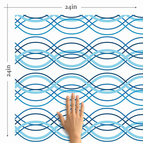 Looking to make waves with your decor choices? Bring home this lovely blue peel and stick wallpaper that pairs geometric sophistication with a breezy nautical vibe. Wave forms in multiple shades of blue run horizontally across its white background and give it a welcoming, relaxed feel that works well in every setting imaginable.&nbsp;Use this PVC-free wallpaper as a different wall treatment for your bathroom, laundry room or even your kitchen backsplash.