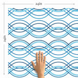 Looking to make waves with your decor choices? Bring home this lovely blue peel and stick wallpaper that pairs geometric sophistication with a breezy nautical vibe. Wave forms in multiple shades of blue run horizontally across its white background and give it a welcoming, relaxed feel that works well in every setting imaginable.&nbsp;Use this PVC-free wallpaper as a different wall treatment for your bathroom, laundry room or even your kitchen backsplash.