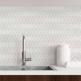 A whimsical woven treatment for your wall, which comes in a convenient peel and stick design! This lovely geometric wallpaper uses gentle geometric shapes in light grey and white to create a weave-like grid. This seamless PVC-free composition can be used as a tactile replacement for plain grey or white walls. It can lend itself to settings ranging from classic to Boho-chic to contemporary.