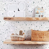 Simplicity laced with a suave edge often makes for a direct route to perfection. Case in point – this unique peel and stick wallpaper bearing a lovely terrazzo pattern in a grayscale palette. Position, remove and reposition it to your heart’s content, because it’s versatile enough to complement just about every design style and setting in your home!