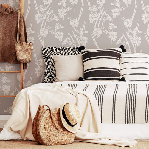 Scattering artistic all-white flowers all over a gray background removable wallpaper